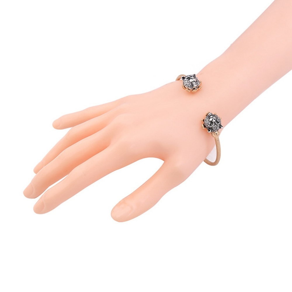Feline cuff bracelet looks like  Gucci